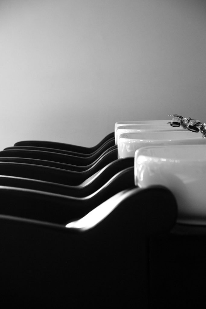 a-black-and-white-photo-of-a-row-of-sinks-qrz6s4ydcim